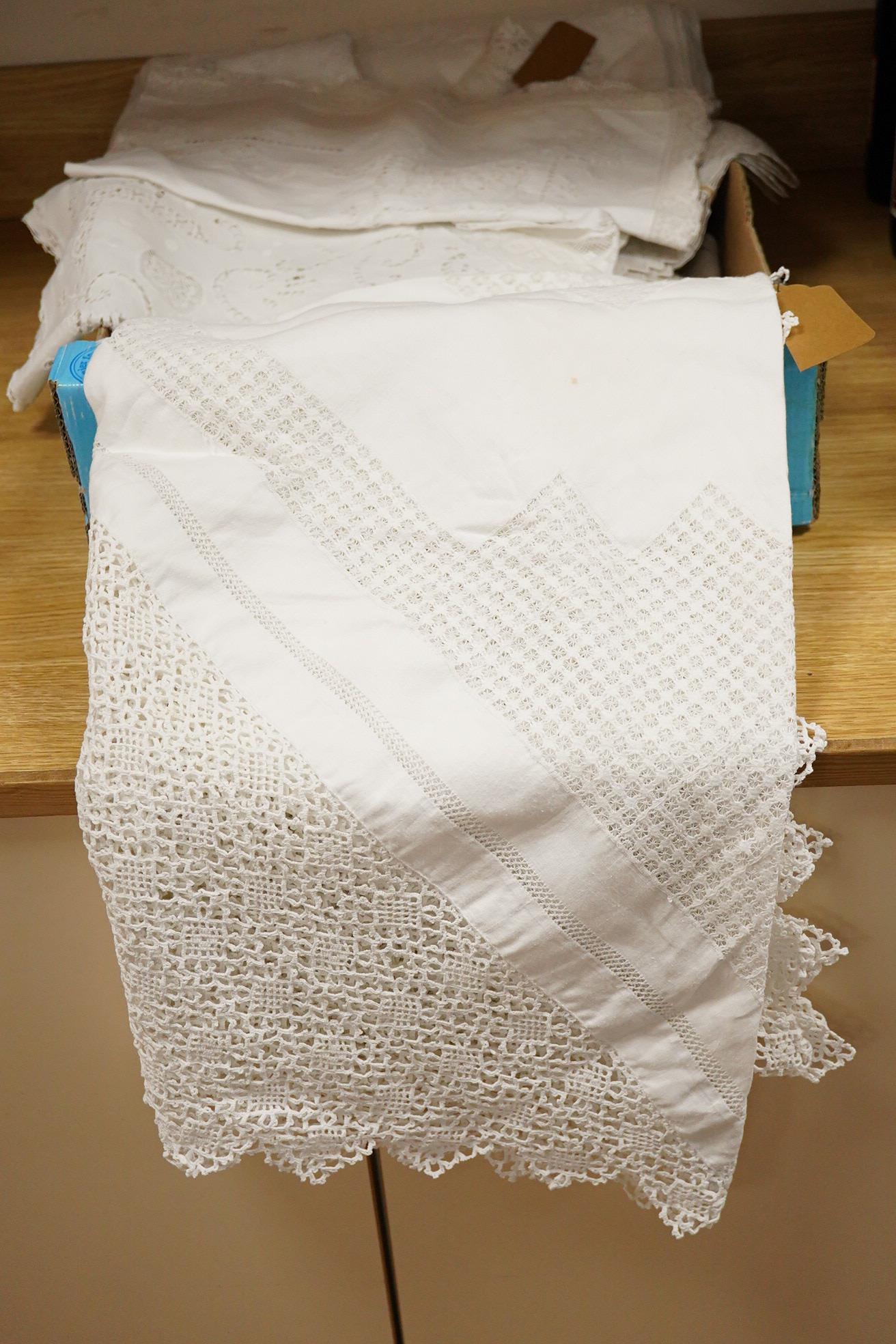 A collection of cutwork, needlework, filet, crochet and drawn thread worked table cloths etc